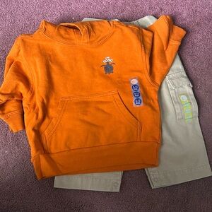 Sweatshirt and tan pants